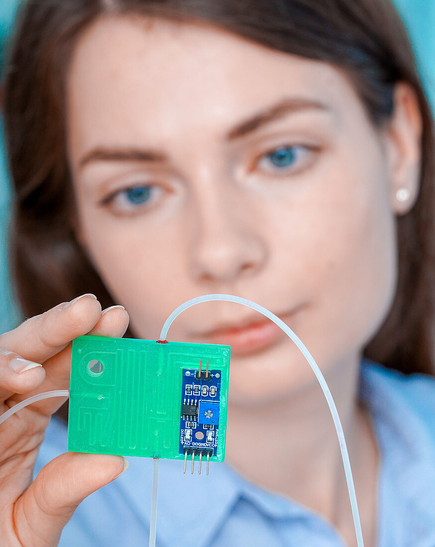 Researcher with lab on a chip