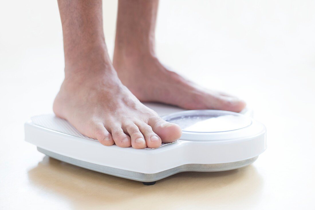 Man standing on weighing scales