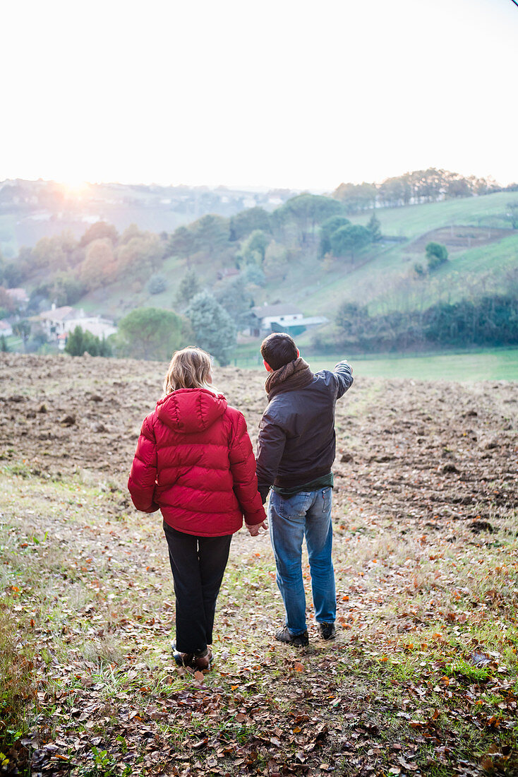 Couple visiting a land in the countryside