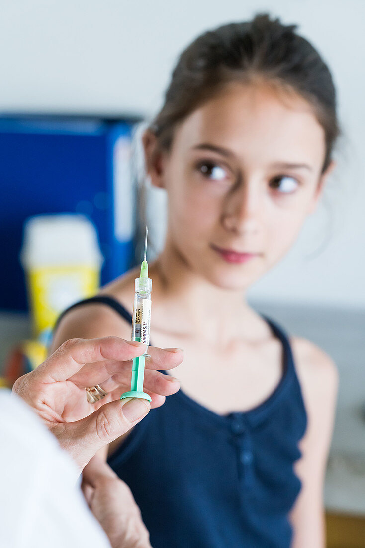 Young girl receiving Gardasil vaccination