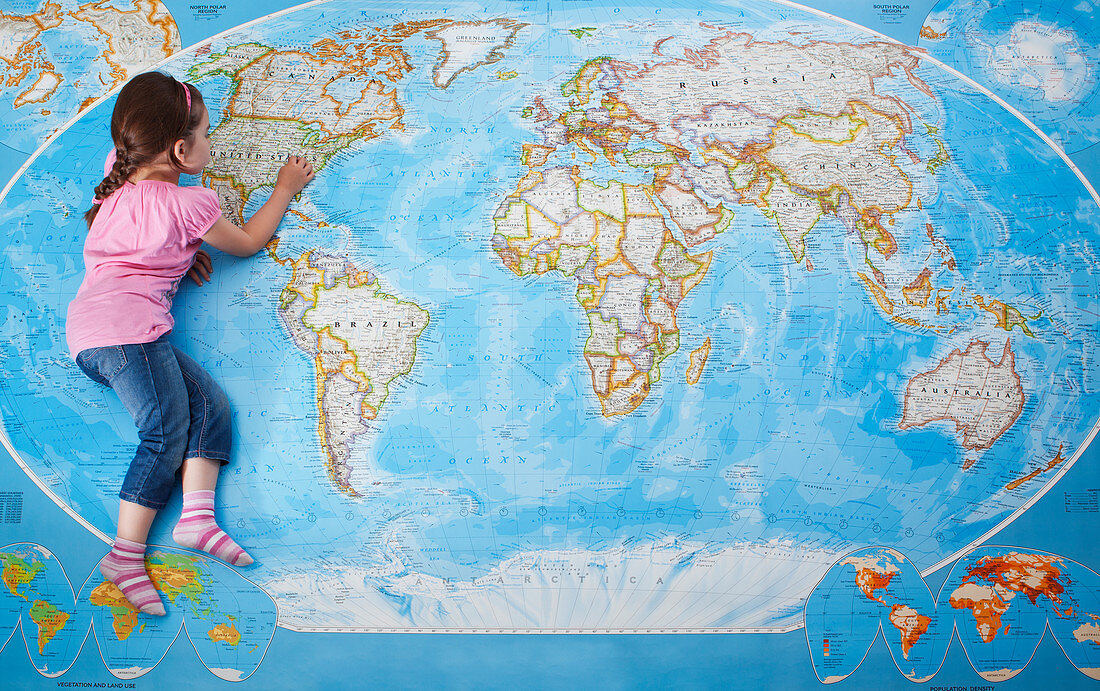 Girl looking at map of the world
