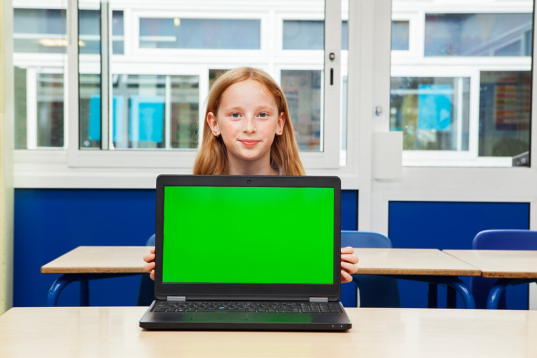 Girl in classroom with laptop
