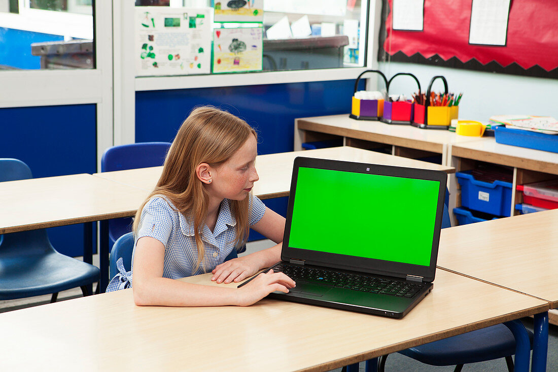 Girl in classroom with laptop