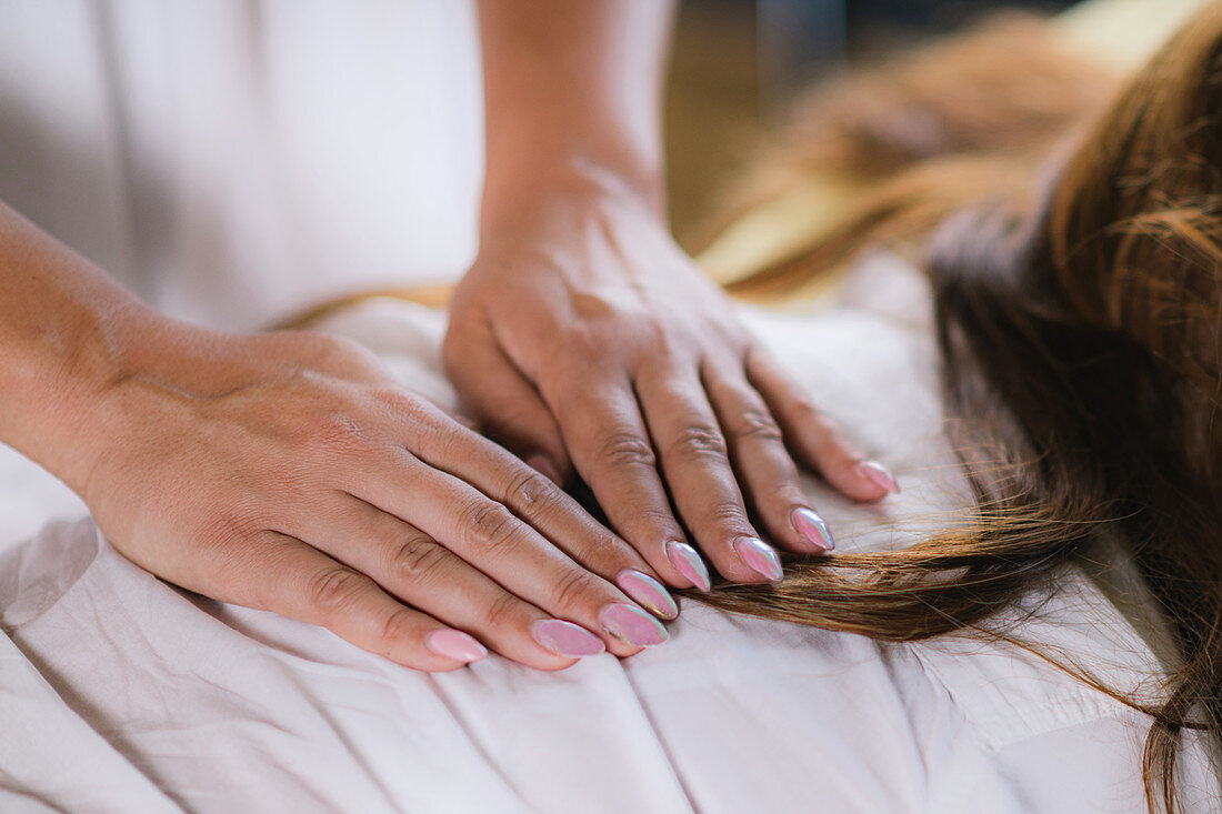 Hands at reiki healing treatment