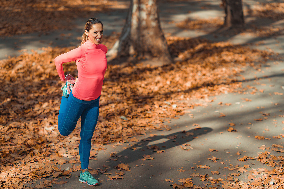 Woman stretching in a park