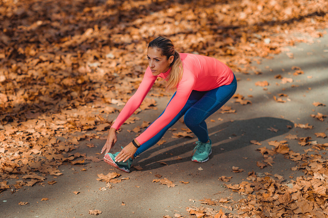 Woman stretching in a park