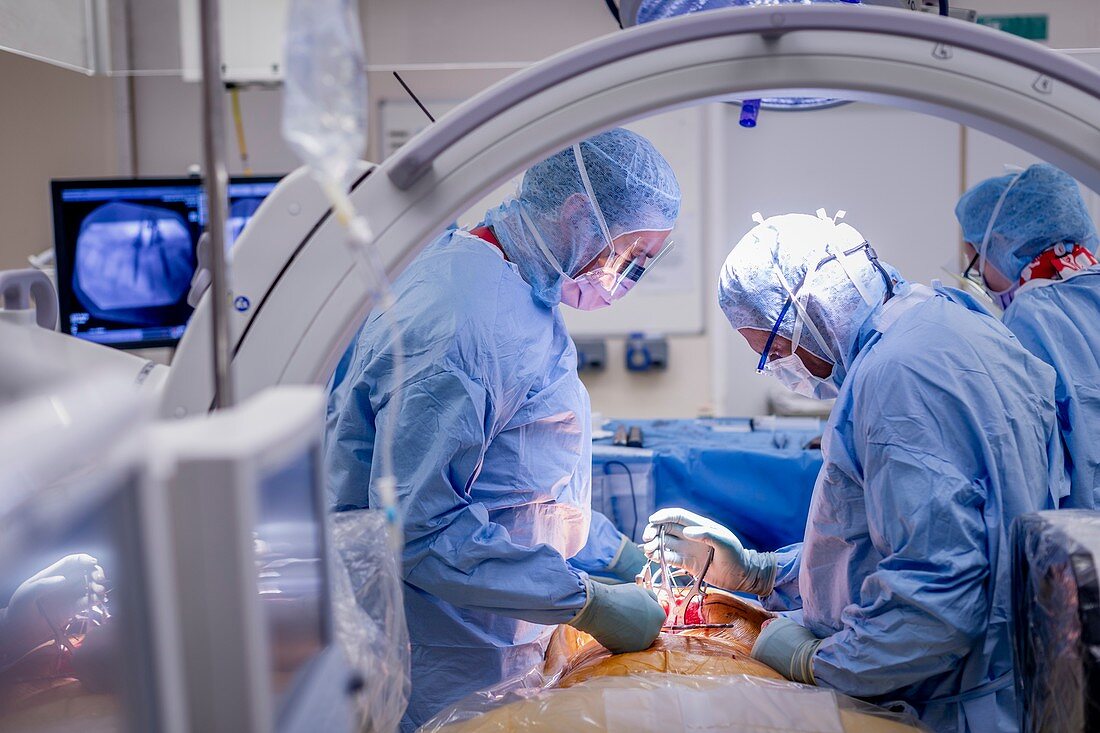 Spinal surgeons performing an operation