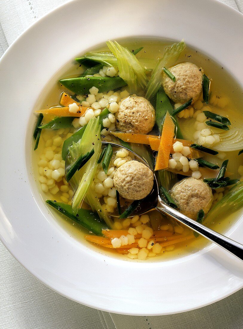 Vegetable soup with meat dumplings & noodles stars