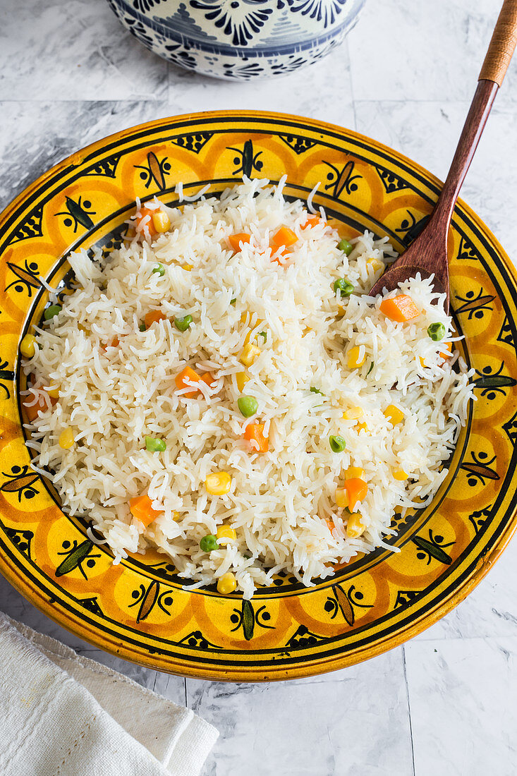 Mexican white rice cooked with peas, corn, carrots and chicken stock
