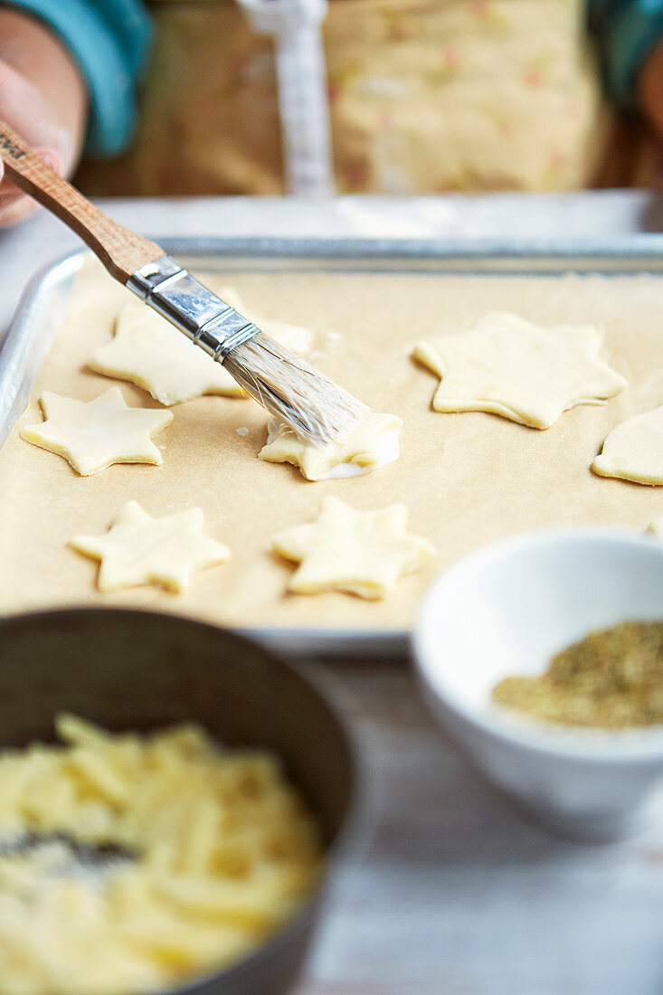 Kid preparing cheesy stars