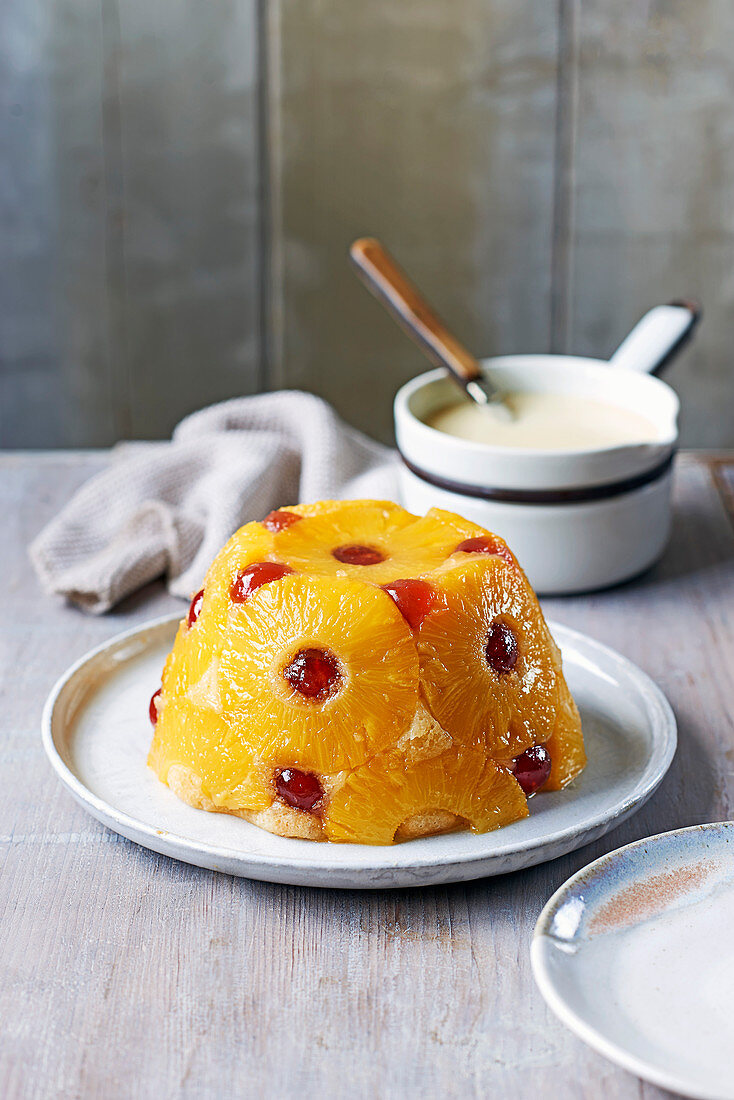 Pineapple and cherry sponge with coconut rum custard