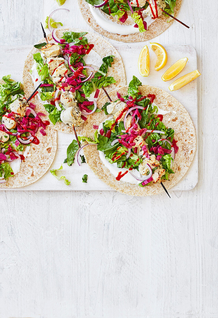 Chicken and lemon skewers with flatbreads
