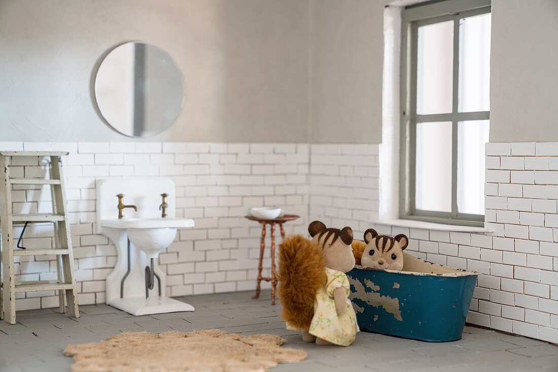 Chipmunk figurines in bathroom of DIY dolls' house