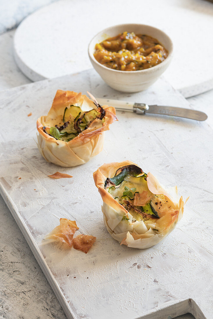 Zucchini cheese tartelettes in filo with mango chutney