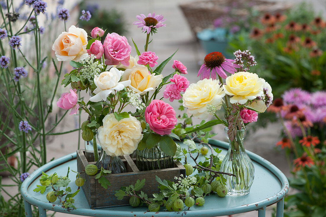 Small bouquets of roses, a sun hat, cumin, oregano and green gooseberries