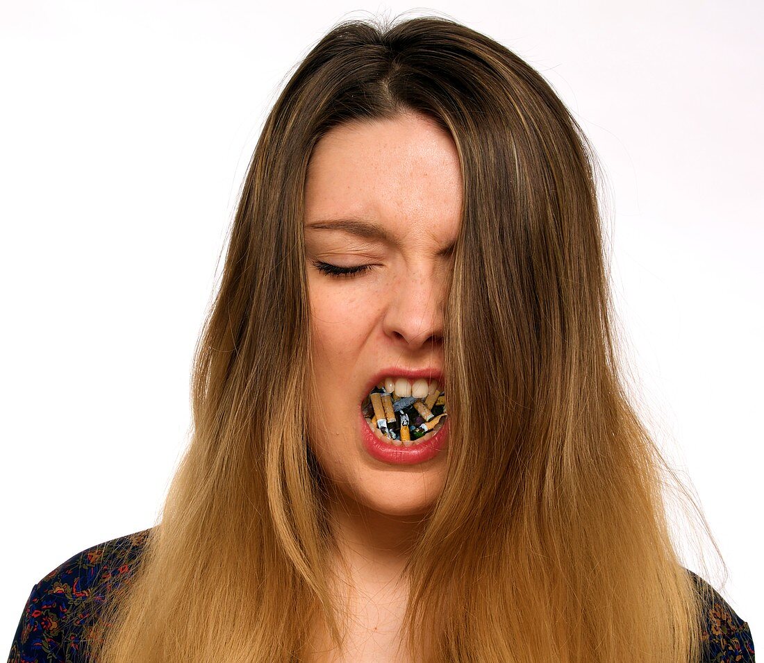 Woman with cigarettes in mouth