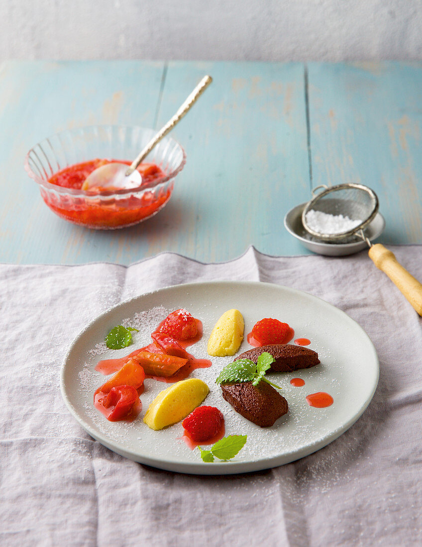 Two kinds of chocolate mousse with strawberry rhubarb ragout