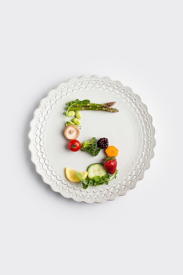 Plate with number 5 made of fruit and greens