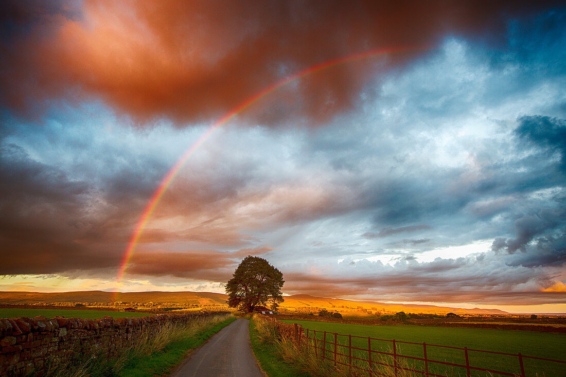 North Pennines, Cumbria, UK, at sunset with rainbow