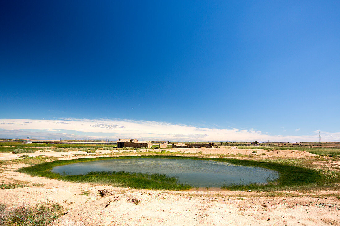 Water hole on the dry Lleida plains, Spain