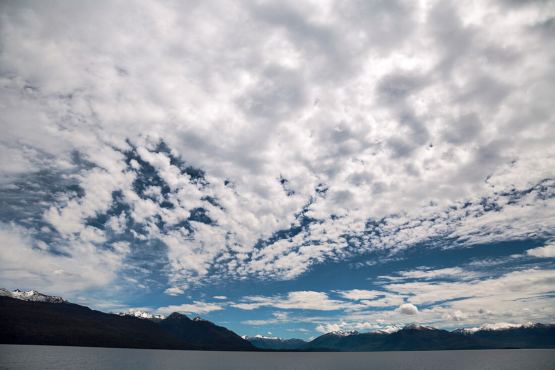Altocumulus stratiformis clouds over New Zealand lake