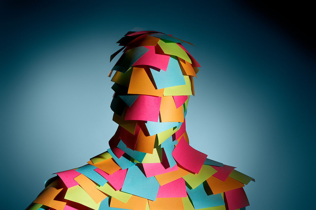 Overwhelmed man covered sticky notes