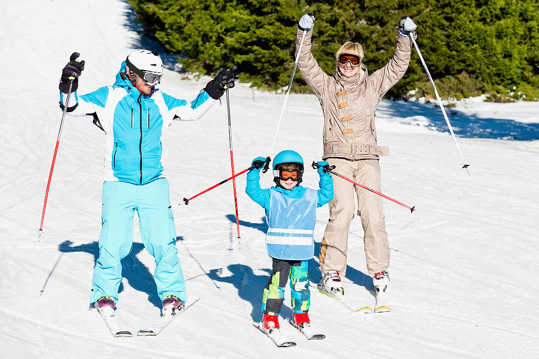 Happy family skiing