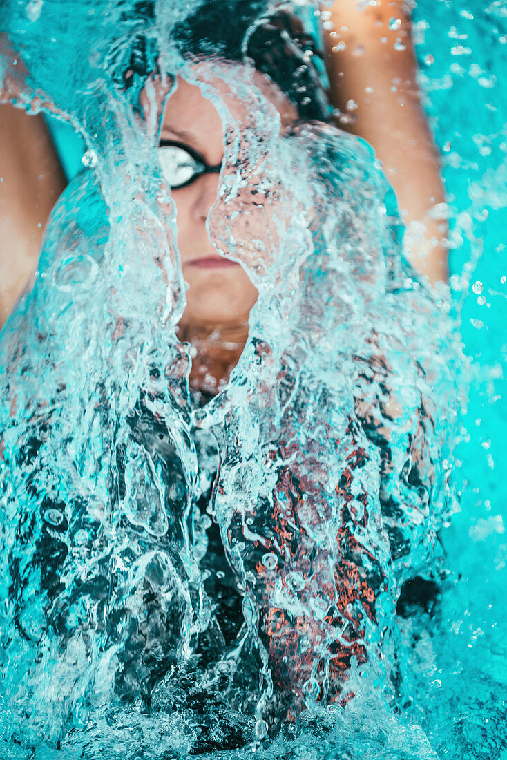 Woman swimming backstroke