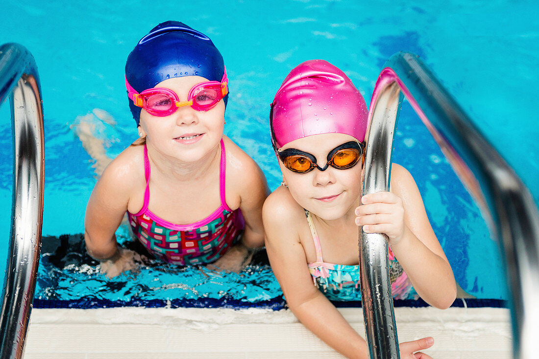 Little girls in swimming pool