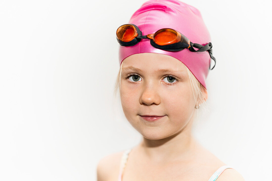 Girl with swimming cap and goggles