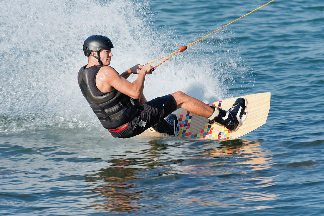 Young man wakeboarding
