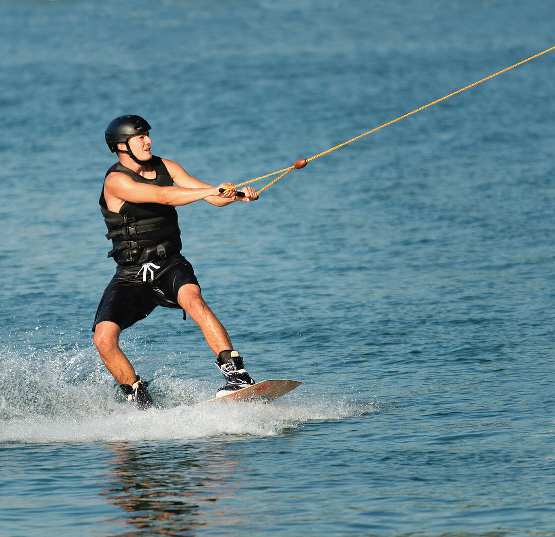 Young man wakeboarding