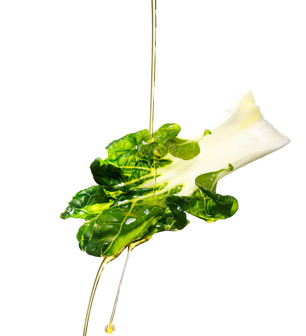 Oil pouring on chard leaf