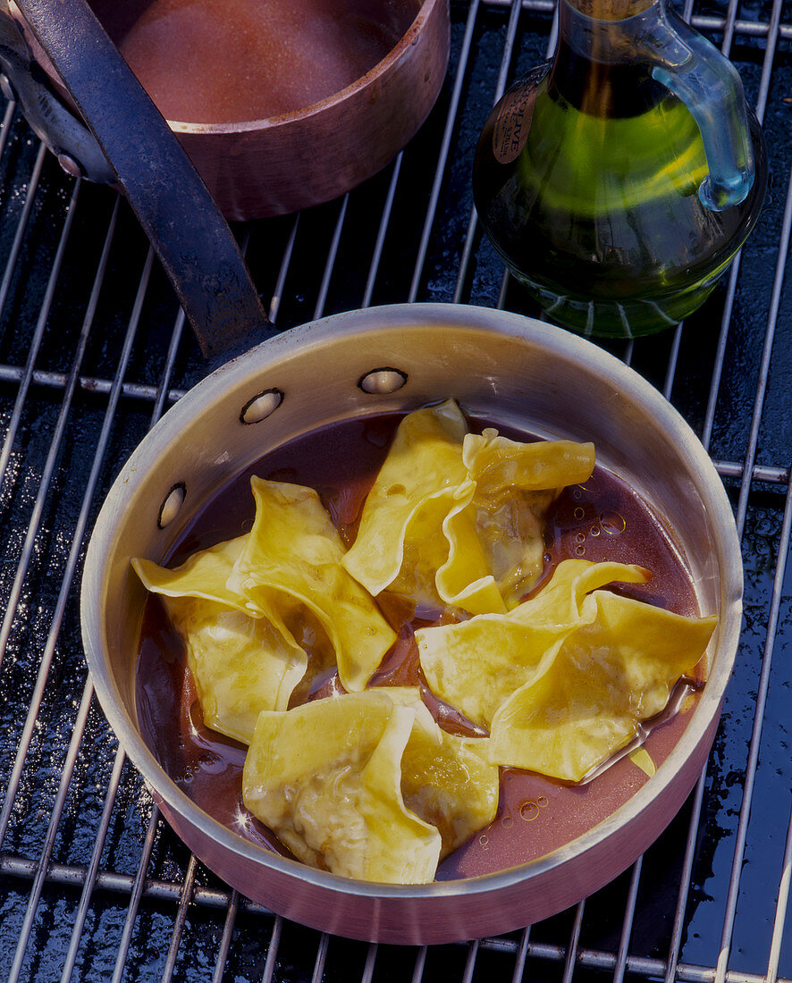 Ravioli with olive oil in a pot