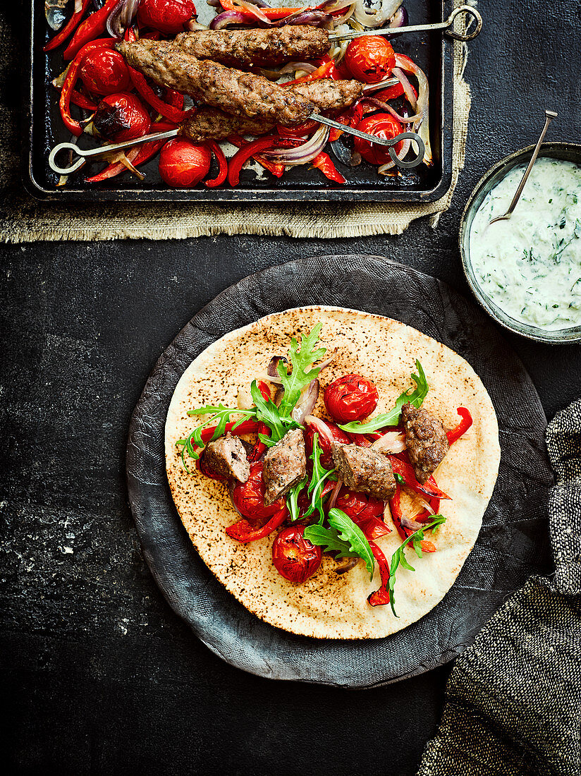 Lamb koftas with roasted vegetables and raita