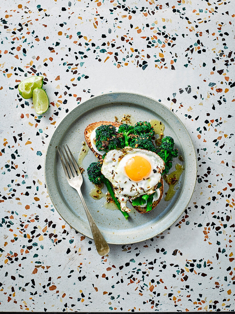 Purple sprouting broccoli, spiced fried eggs and lime yogurt on toast