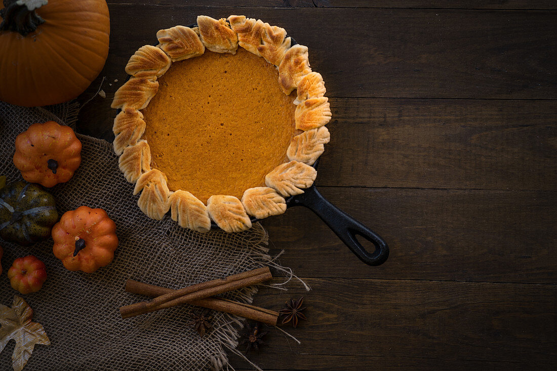 Homemade pumpkin pie baked in cast iron pan