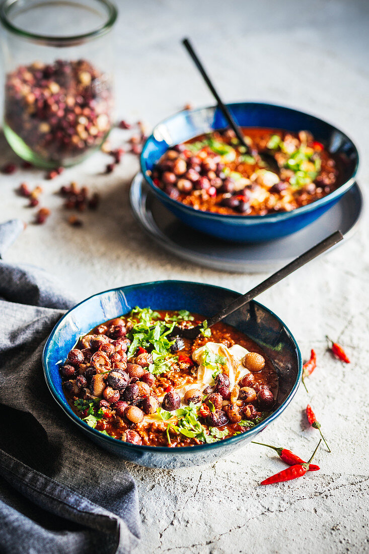 Smoky chilli con carne with crispy bambara groundnuts