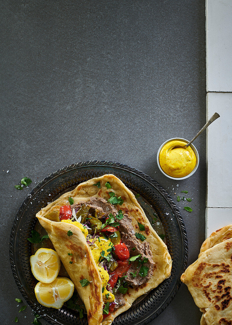 M’semen with mushroom pâté, roasted peppers, cabbage and turmeric mayonnaise