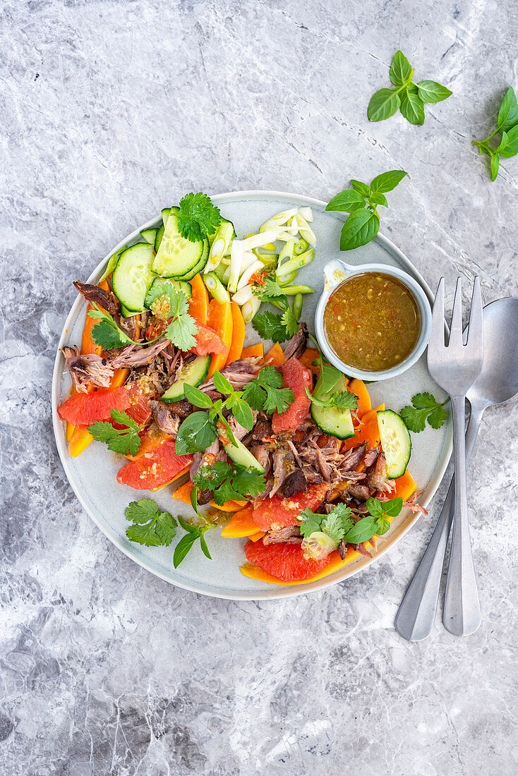 Crispy duck salad with marinated papaya, grapefruit and a lime dressing