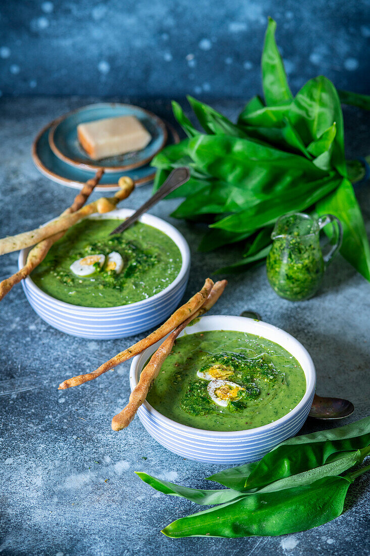 Wild garlic cream soup with quail egg