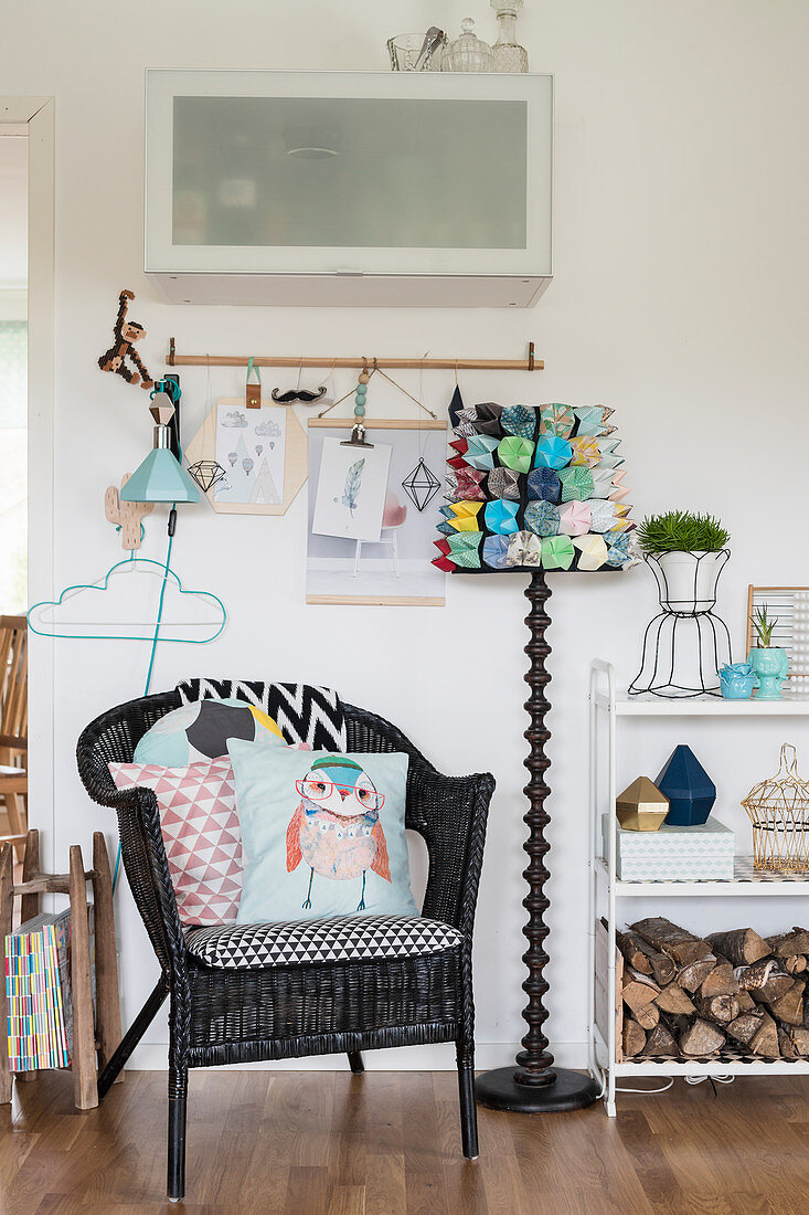 Black wicker chair and standard lamp with DIY lampshade