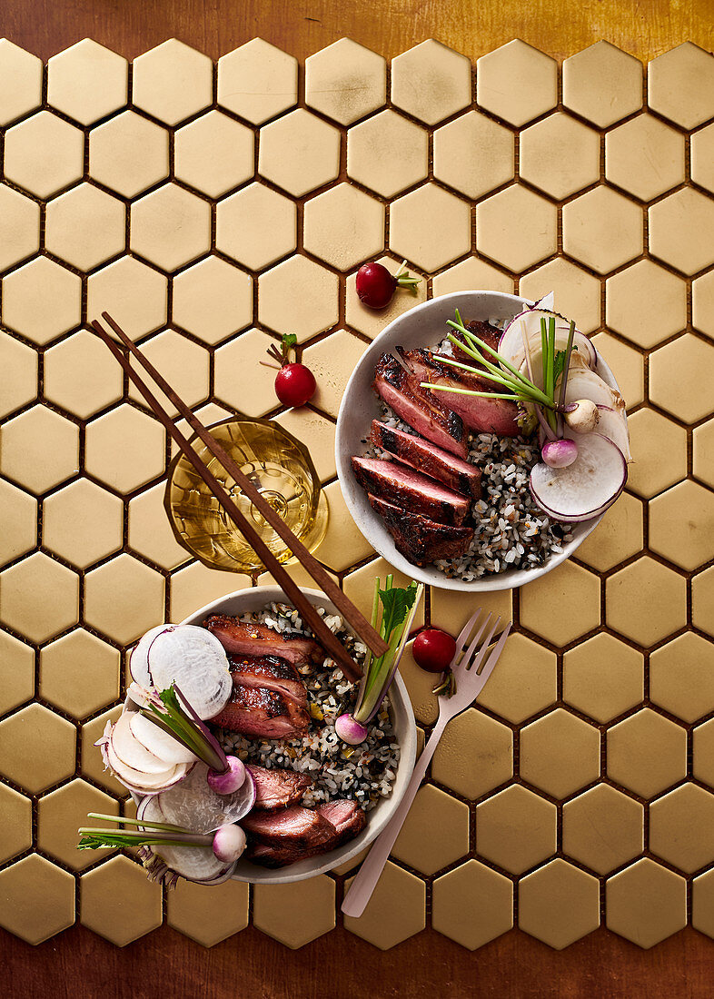 Smoky honey-glazed duck breast with sesame rice and tangy turnips