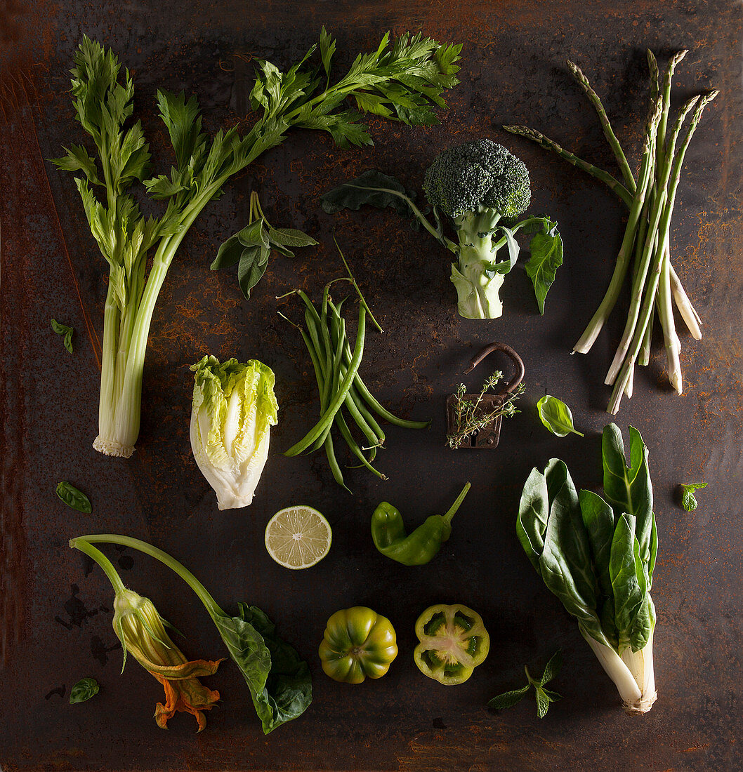 Still life with green vegetables on a metal background