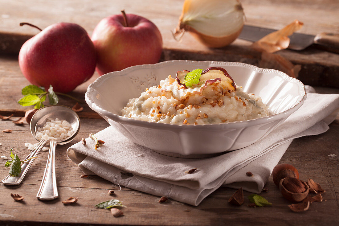 Gorgonzola risotto with apple chips and roasted hazelnuts