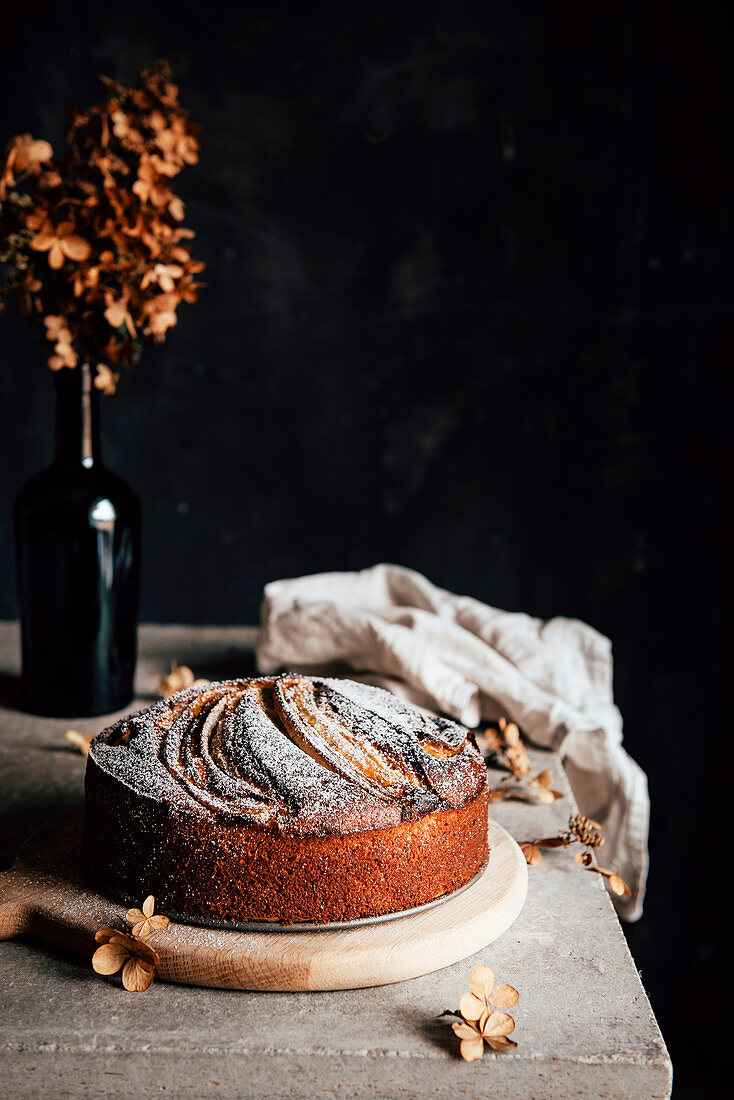 Banana bread on table against a black background