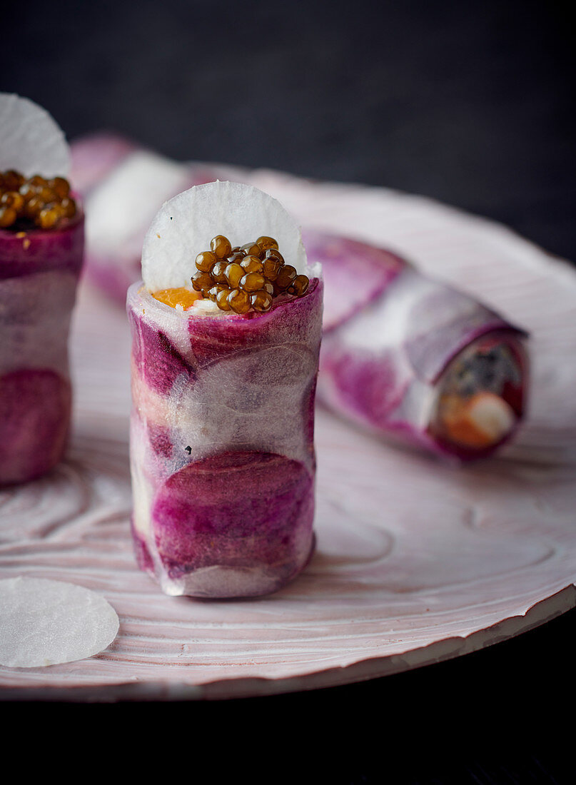 Rice paper rolls with prawns, purple carrots and caviar