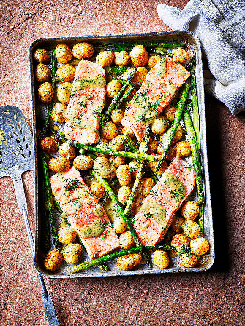 Sea trout, new potato and asparagus traybake with dill mustard sauce