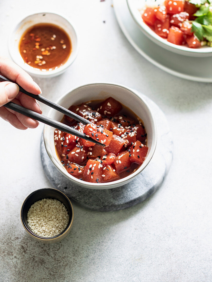 Sauteed watermelon poke bowl served with rice, cucumbers, and sprouted adzuki, lentil and beans