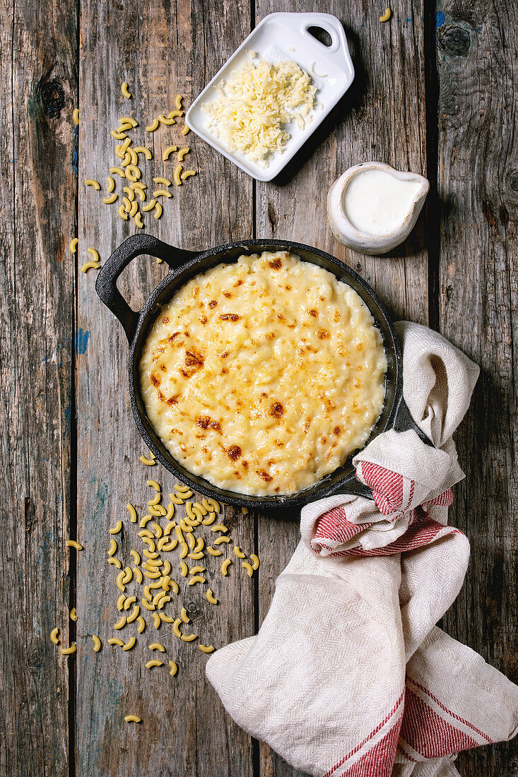 Classic american dish baked mac and cheese in cast iron pan